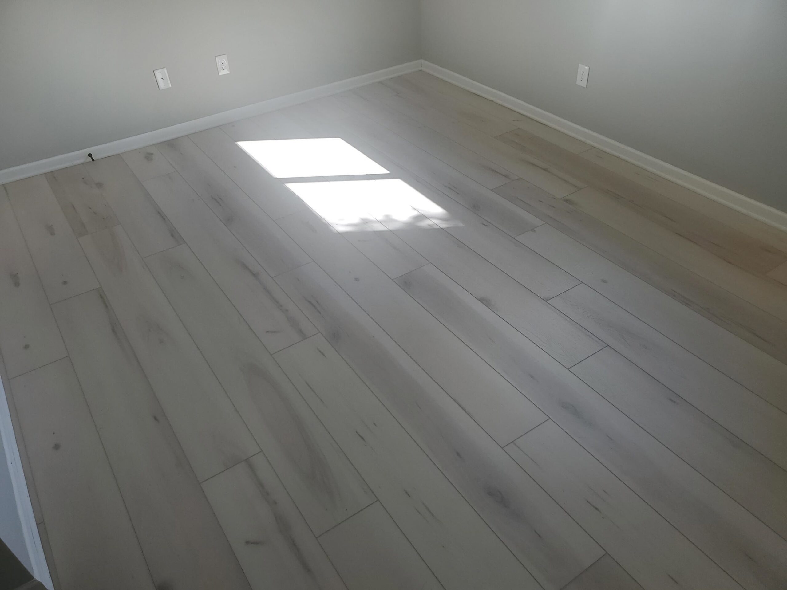 Luxury vinyl plank flooring installation basement waterproof Flooret Lenexa KS