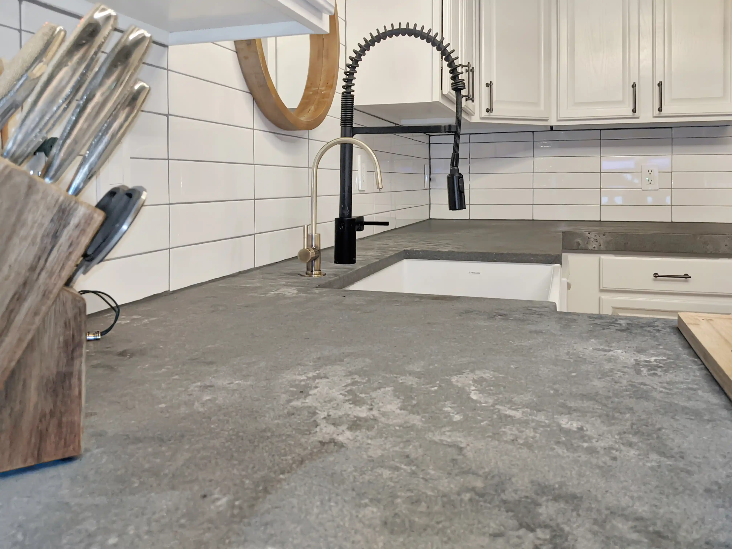 Precise grout lines on white vertical subway tile backsplash - Kansas City
