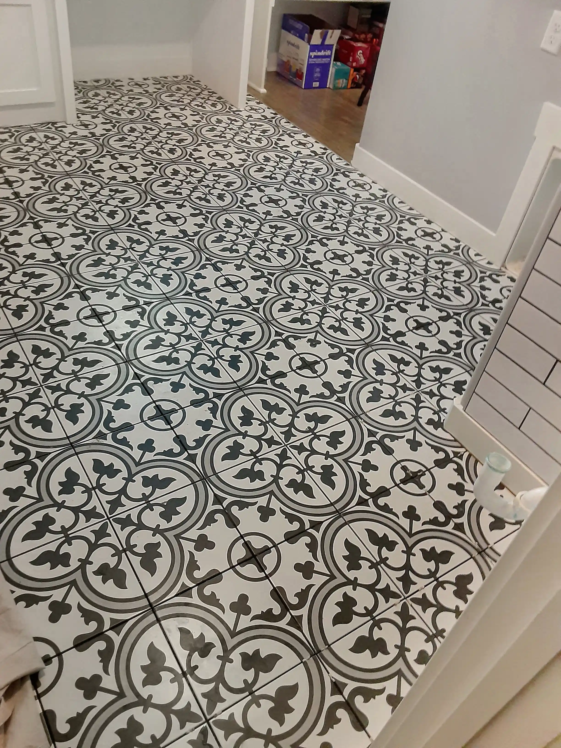 Laundry room floor tile with painted design - Overland Park, KS