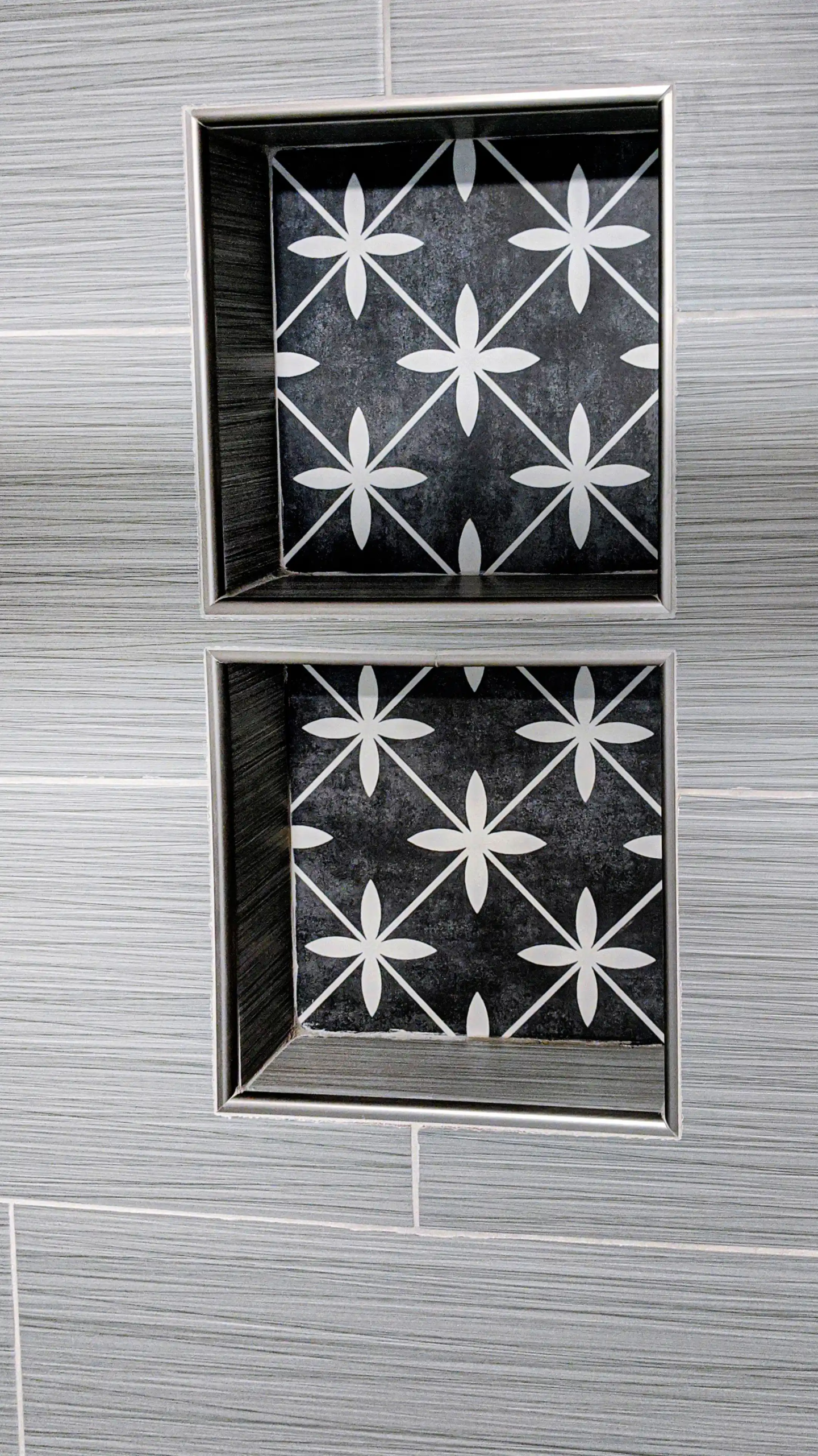Custom painted tile design with double vertical niche