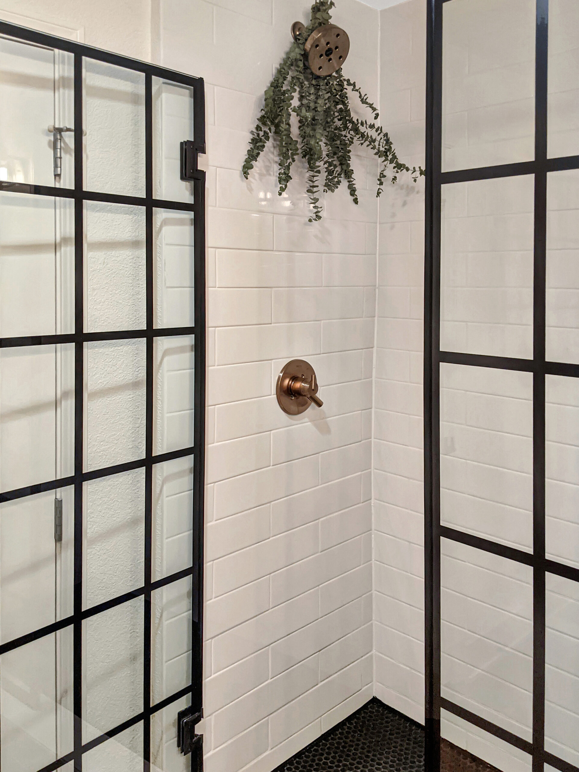 Tile shower with brass hardware and glass door biophilic design Kansas City