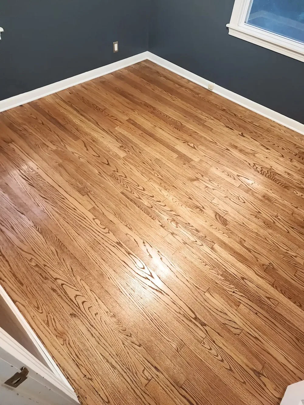 Refinished red oak hardwood floor with a satin finish in a Prairie Village, KS home